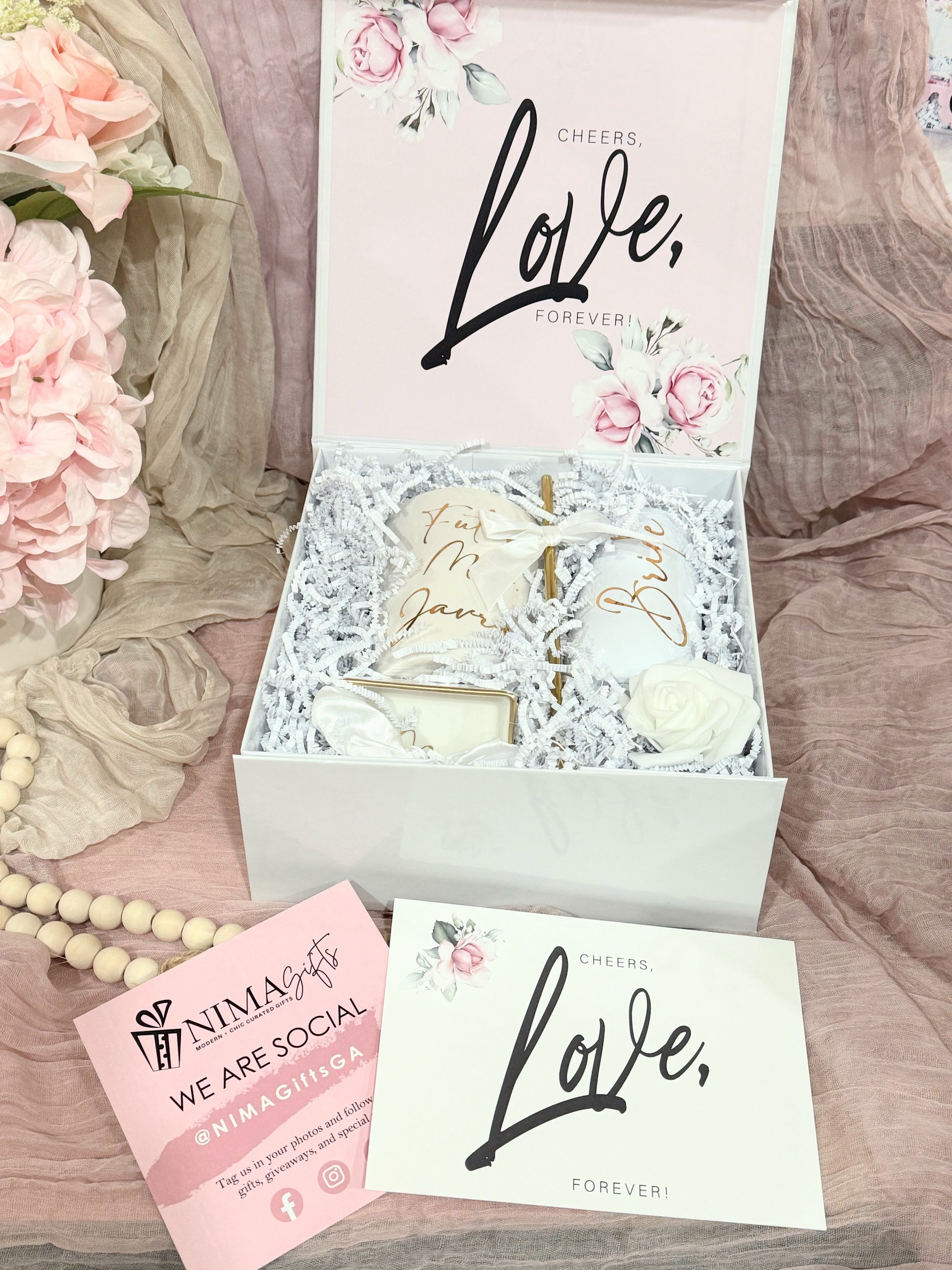Future Mrs. engagement gift box featuring a personalized white ceramic mug with gold lettering, a chic porcelain ring dish, a stainless steel champagne flute, a satin hair scrunchie, and bridal shower must-haves, all styled in a luxury white keepsake box with satin bow — the perfect personalized bride-to-be gift for engagements, weddings, or bridal showers.