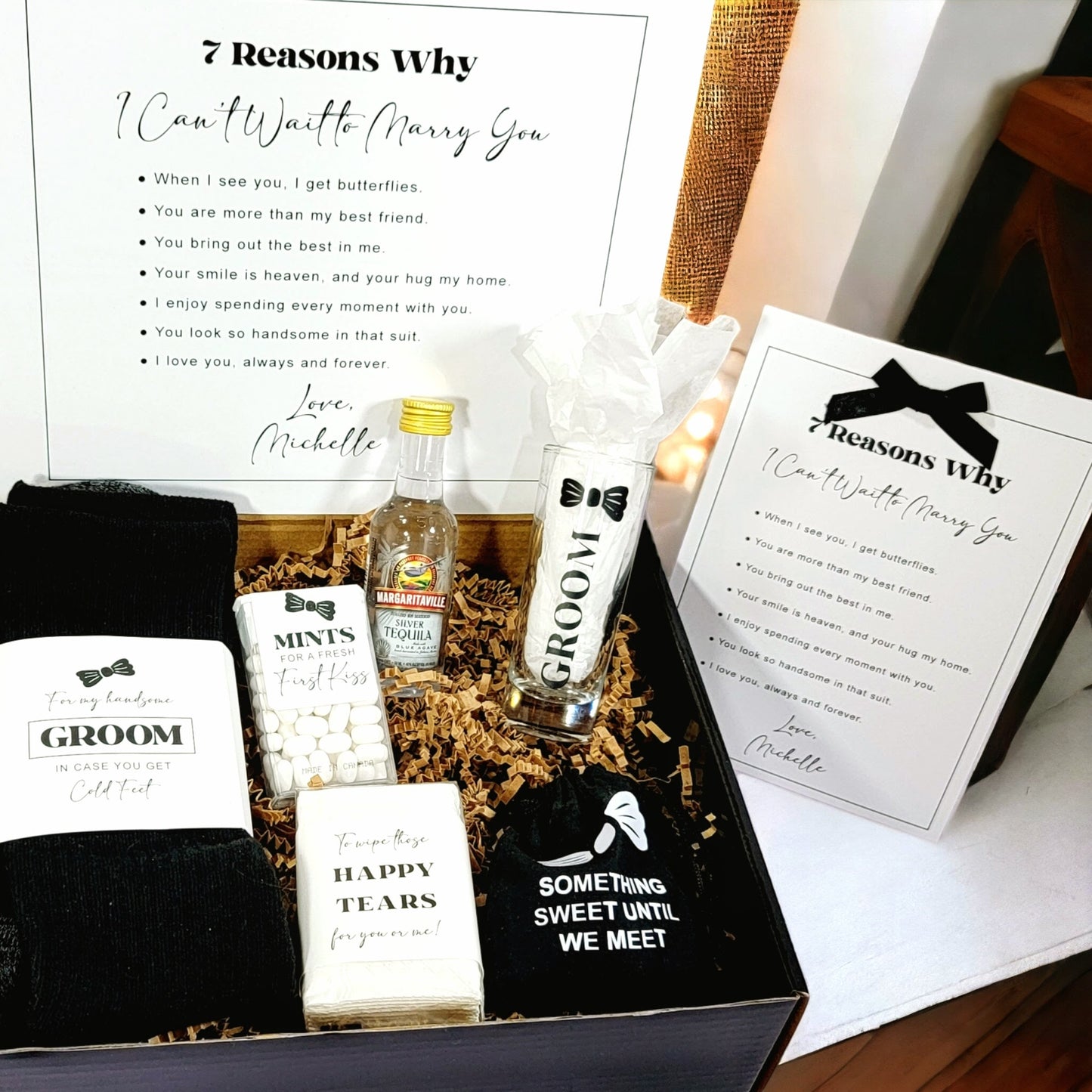 Groomsmen gift box with items and '7 Reasons Why I Can't Wait to Marry You' cards.