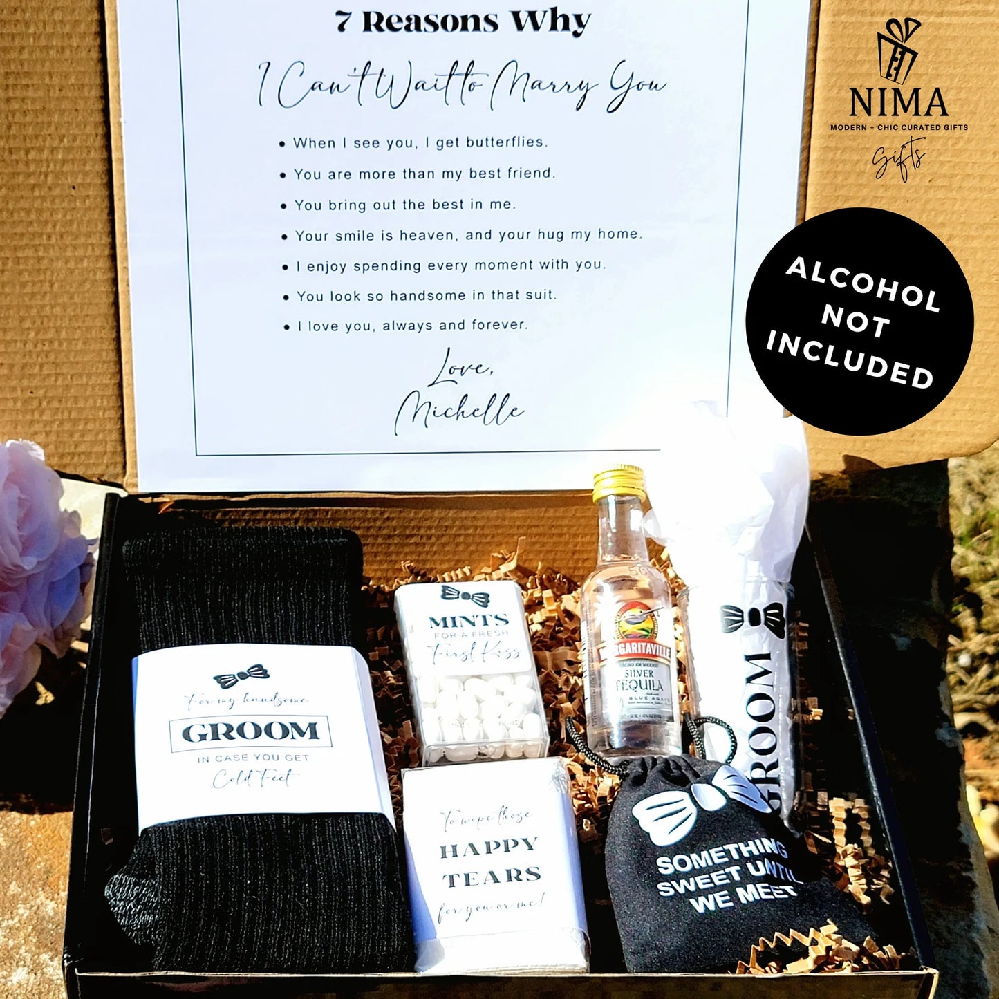 Gift box with groomsmen items including socks, mints, and a bottle of alcohol, branded 'NIMA Gifts'.