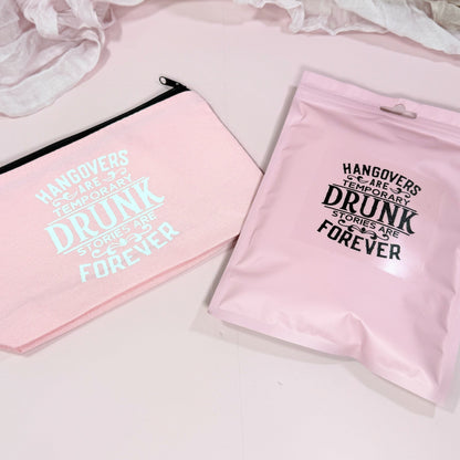 Two pink pouches with humorous text on a light background - showcasing the packaging options for NIMA Gifts Hangover Recovery Kit