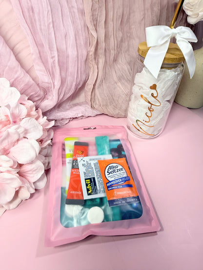 Pink Poly Pouch package showing what a packed Hangover Recovery Kit looks like packed with products (front side of package)