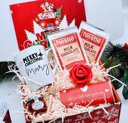 Christmas gift box for women with assorted holiday treats and accessories, perfect for friends or colleagues.