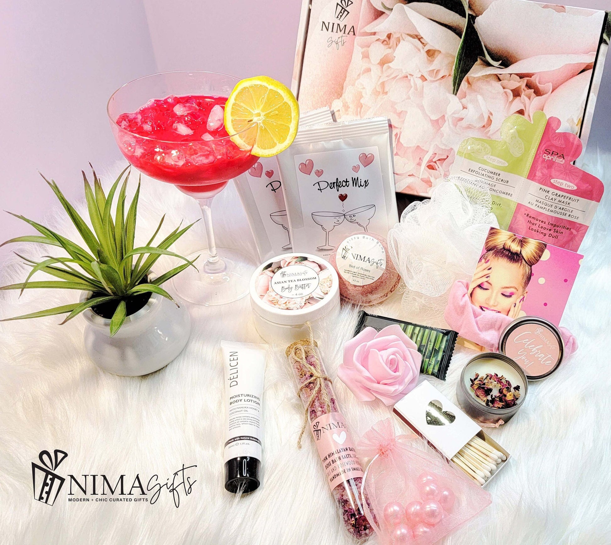 A close up view of NIMA Gifts Luxury margarita lover gift set with personalized box, margarita glass, margarita mix, lavender candle, bath bomb, many more spa items and  card arranged in premium peonies printed box.