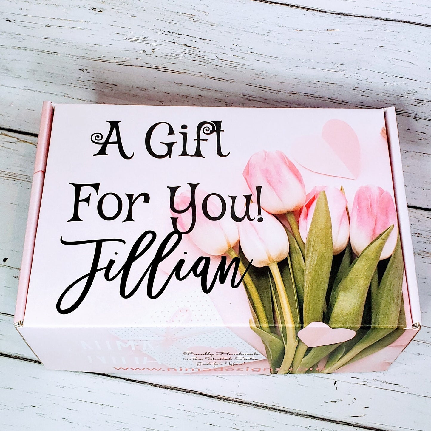 A pink gift box with a bouquet of pink tulips and the text "A Gift For You! Jillian" on the front.