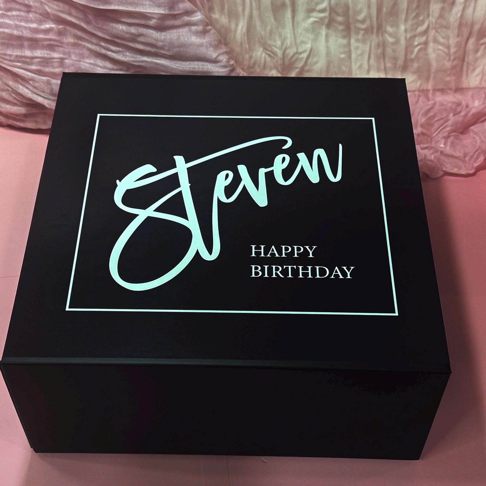 Elegant black magnetic gift box with personalized lid text reading “Steven Happy Birthday” in bold modern script. Luxury packaging meets personalization in this customizable men’s gift box, perfect for birthdays, Father’s Day, anniversaries, Christmas, or Valentine’s Day. A chic, modern choice for women looking for boyfriend gifts, husband gifts, or dad gifts – stylish, practical, and totally unforgettable. Ready-to-gift and designed to impress from the moment he opens it.