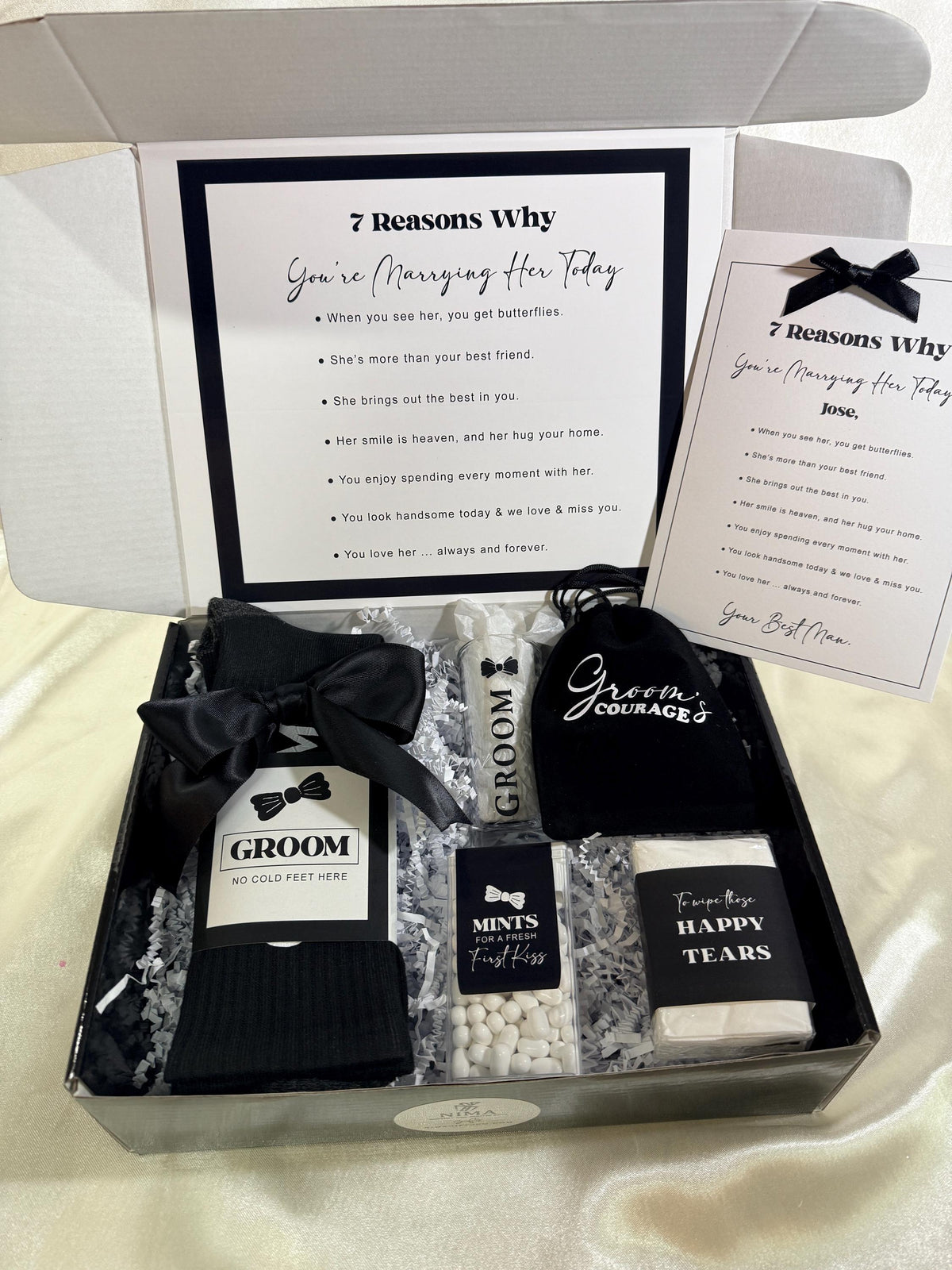day of wedding gift box from best man to groom with contains a pair socks that sat “Groom” with “NO COLD FEET HERE” on the packaging, a shot glass that says groom, a box of mints for a fresh first kiss, a pack of tissues to wipe away those tears, and a black velure bag that says “Groom’s Courage” on it filled with candy.