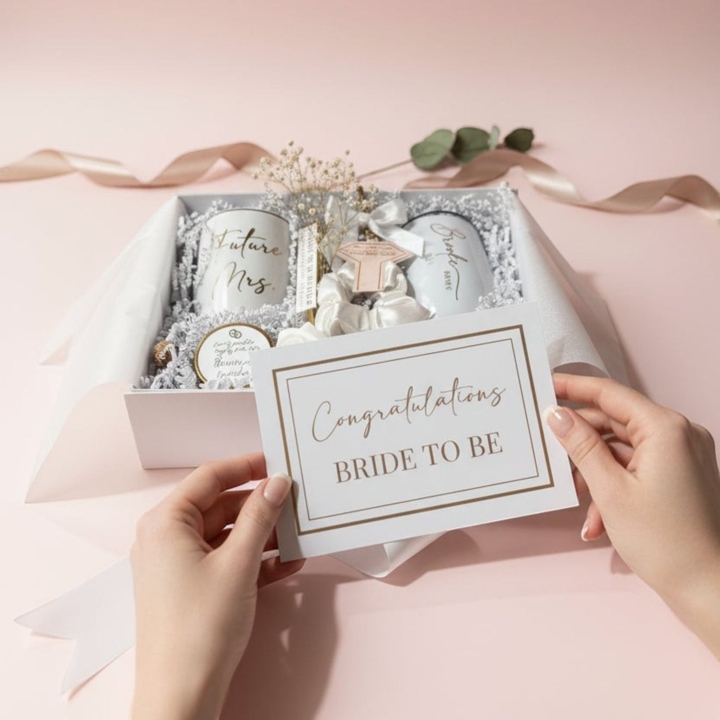 Gift box with 'Congratulations Bride to Be' card on a pink background