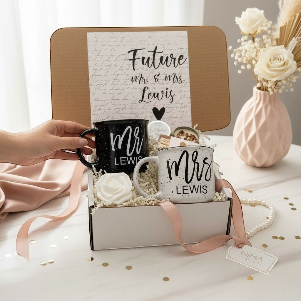 Personalized Mr. & Mrs. campfire mug engagement gift set with a black speckled mug for 'Mr.' and a white speckled mug for 'Mrs.' with couples future last names on the mugs with candle and matches.