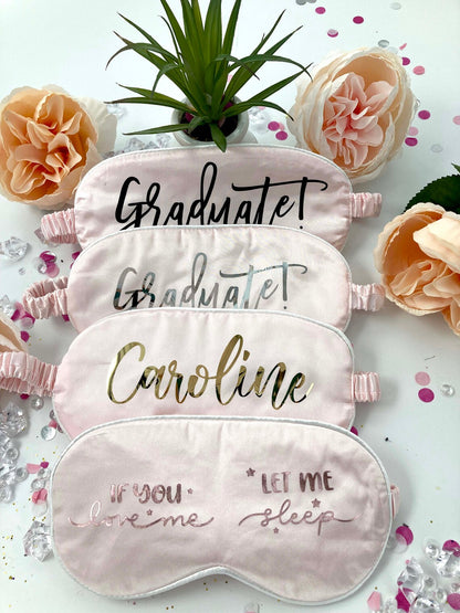 Silky satin graduate sleep mask with graduation-themed design, ideal for gift or personal use, in a soft, comfortable fit.