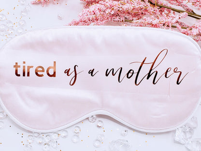 Personalized silky satin sleep mask with "Tired as A Mother" text, soft fabric, ideal for relaxing or gifting to moms.