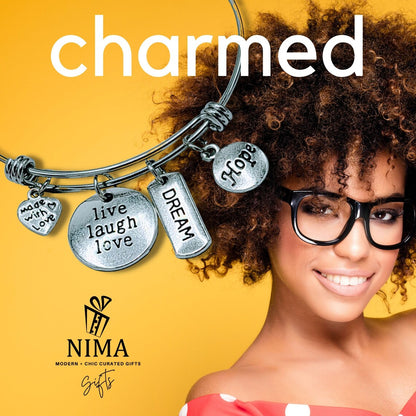 Friendship Inspiration charm bracelet with colorful beads and charms, featuring a heart and star design on a silver-tone bracelet.