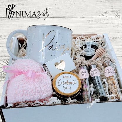 Tea lover birthday gift set featuring a cozy spa basket, personalized mug, and assorted gifts for women, presented in a decorative box.