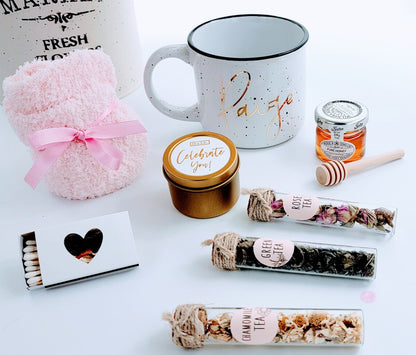 Tea lover birthday gift box with personalized mug, cozy spa basket for women, including tea, candles, and relaxation items.