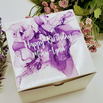 Purple self-care gift box with lavender spa products, perfect for women and best friends, featuring thoughtful pampering items.