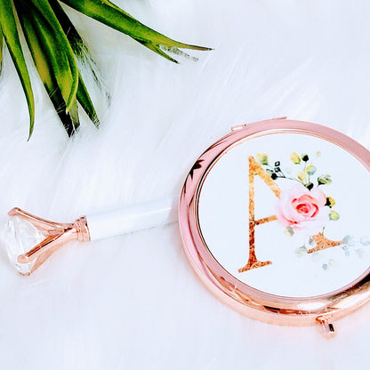 Personalized floral initial compact mirror by NIMA Gifts, perfect for bridesmaids, flower girls, or birthdays.