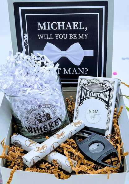 Personalized groomsmen proposal gift box with "Will You Be My Groomsman" message, featuring a custom engraved keepsake and gift items.