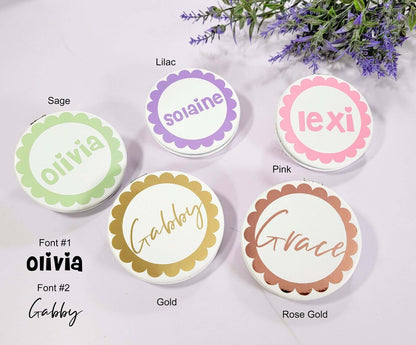 Pink and purple flower girl proposal compact mirror by NIMA Gifts with gold accents, featuring floral design and a pocket-sized mirror.