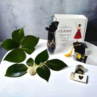 Elegant personalized graduation gift box for women by NIMA Gifts, includes luxury items for college or high school graduates.