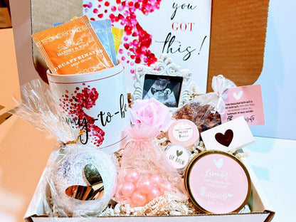 Pregnancy gift basket with postpartum care items and baby shower presents, designed for expecting new moms and celebrating motherhood.
