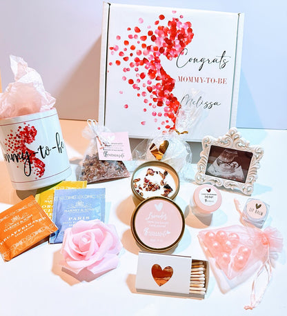 Pregnancy gift basket with postpartum care items and baby shower gifts, featuring items for new moms and expecting mothers.