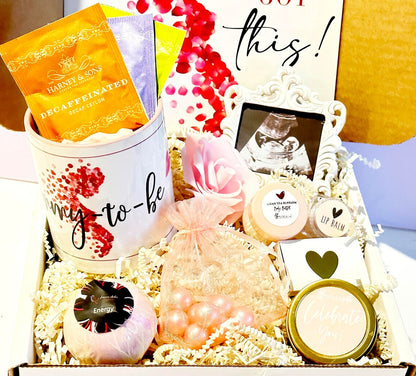 Pregnancy gift basket with postpartum care items and baby shower gifts, ideal for new moms and expecting mothers.