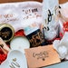 Personalized graduation gift box for her, featuring celebration items for college, master's, or high school graduates.