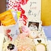 Pregnancy gift basket with postpartum care items and baby shower gifts, featuring soothing products for new moms.